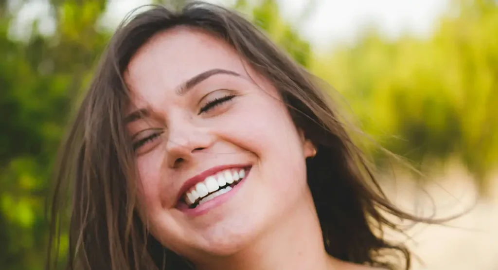Happy Girl With Lumineers Smiling