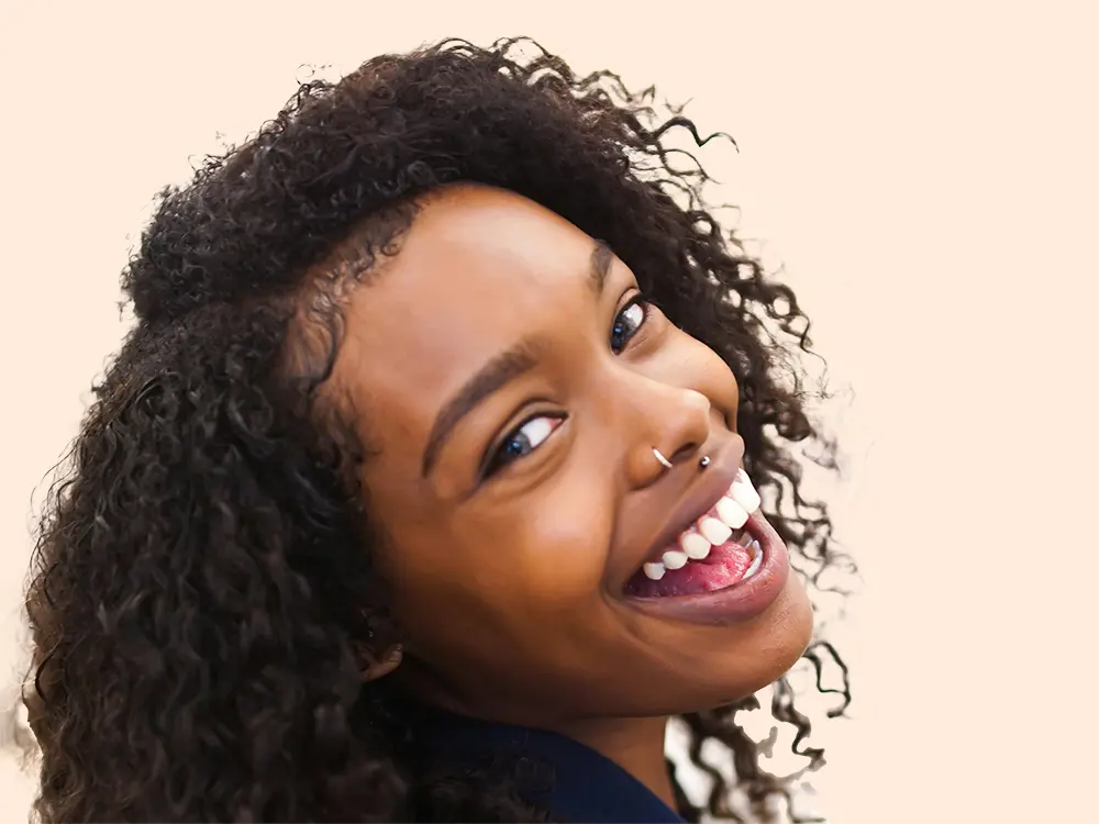 Patient Smiling After Dental Bridge Procedure